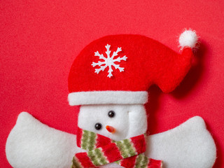 Cute snowman wearing Santa Claus hat