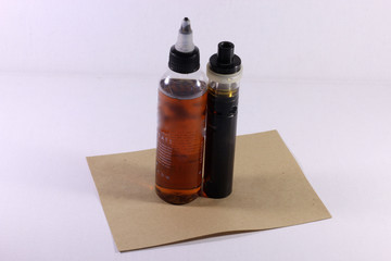 Electronic cigarette with liquid on a white background