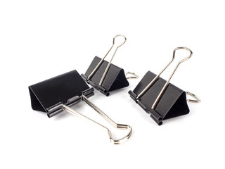 Black paperclips on white background