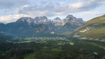 Fototapeta premium Aerial view of mountain range with snow in the alpine mountains