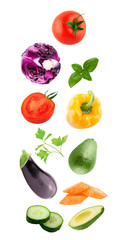 Fresh flying vegetables ingredients isolated on a white background.