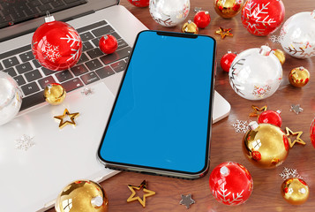 Mobile phone laying on laptop with christmas baubles mockup 3d rendering