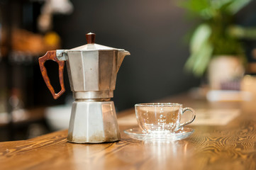 The concept of morning coffee. Pour the morning coffee. A quick revival. Old Italian coffee machine.