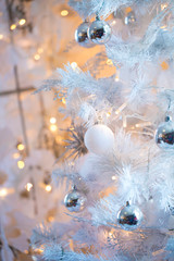 Christmas  background in white with white Christmas tree. closeup shot. blurred background