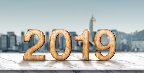 New year 2019 wood number (3d rendering) on white marble table at blur abstract cityscape bokeh background,Mock up banner space for display or montage of product,holiday celebration greeting card.