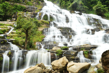 Beautiful waterfall with stones in forest, Thailand