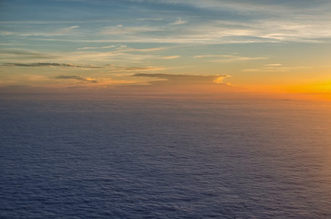 Fototapeta na wymiar atmospheric mood above the clouds at sunset