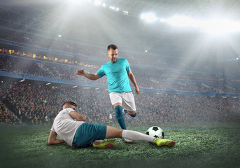 Soccer player on a football field in dynamic action at summer day