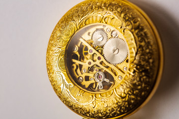 the inside of a classic watch gear wheels of a pocket watch
