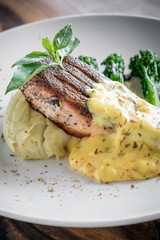 grilled salmon fish fillet with mashed potato and mustard sauce
