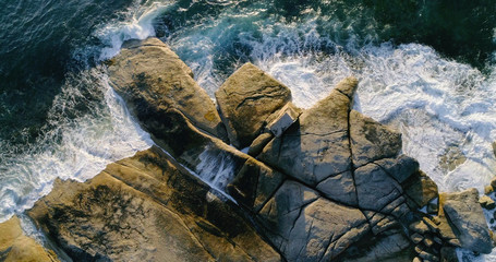 Drone shot doverlooking rugged coastline near Bicheno, Tasmania, Australia.