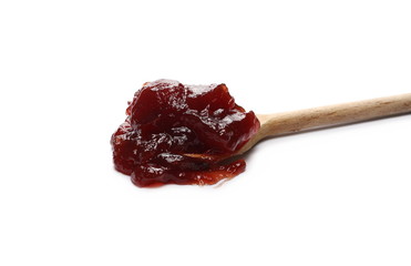 Strawberry jam, marmalade with wooden spoon isolated on white background and texture