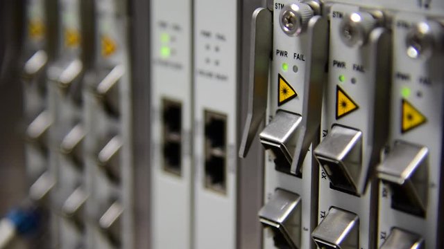 Networking Temecommunication fiber optics cable patch cord connected and blinking of led status in data center