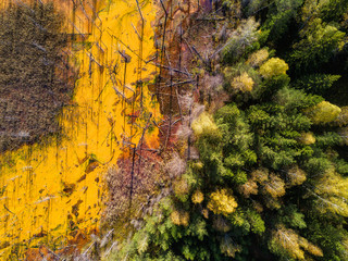 Aerial shot of pollution by toxic waste flowed to the surface and destroys forests and lakes