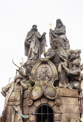 Fototapeta na wymiar Statues of Saints John of Matha, Felix of Valois, and Ivan on Charles Bridge in Prague, Czech Republic