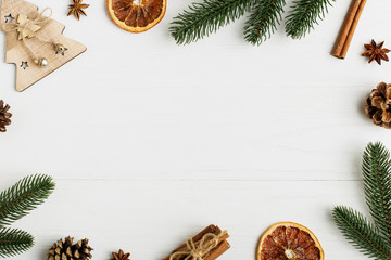 Decorative frame, christmas attributes on a white wooden table. Place for text, blank for postcard. Copy space.