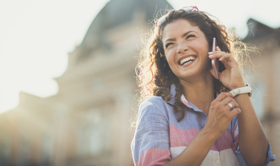 Hearing his voice makes her smile.
