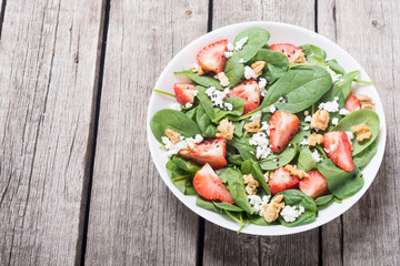 Strawberry salad with spinach , cheese and walnut