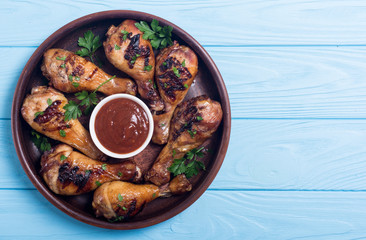 Grilled chicken legs with tomato sauce