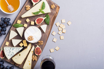 Obraz na płótnie Canvas Cheeseboard with cheese brie , parmesan , camembert and dorblu