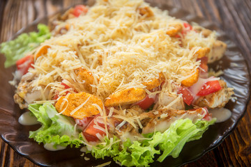 salad in a plate on a wooden background