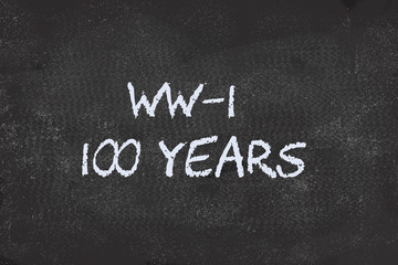 Fototapeta premium 100 years of World War 1 written on black board