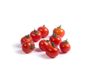 Cherry tomatoes on white surface