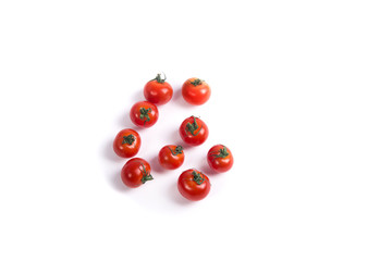 Cherry tomatoes on white surface top view