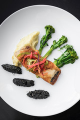 red snapper fish fillet with vegetables and black sesame rice