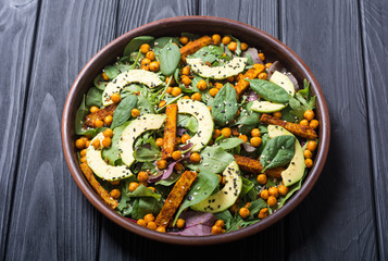 Baby spinach salad with sweet potato , chickpeas and avocado