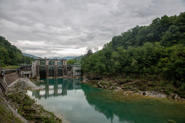 Fototapeta na wymiar Huge dam on colorful river