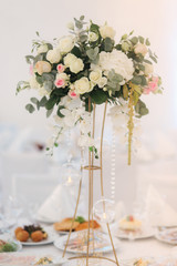 Wedding bouquet in restaurant on the table. Pink and white flowers. Rose and hydrangea