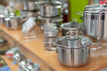 Kitchen pans on the shelf in the store.