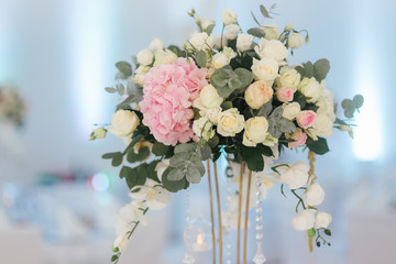Wedding bouquet in restaurant on the table. Pink and white flowers. Rose and hydrangea