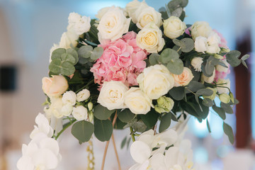 Wedding bouquet in restaurant on the table. Pink and white flowers. Rose and hydrangea