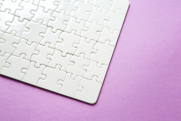 Assembled puzzle on color background