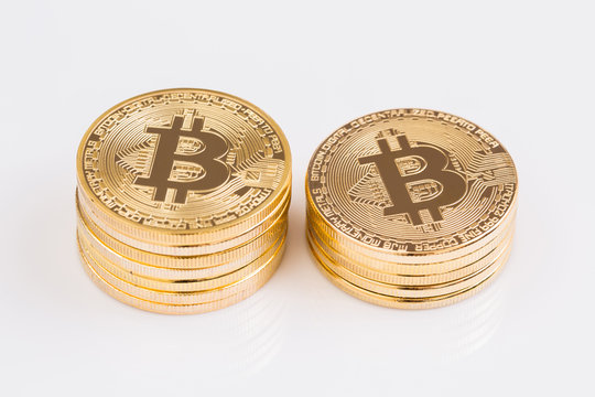 Gold bitcoin on white background