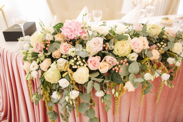 Floral decoration on the wedding table in restaurant