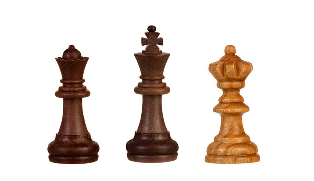 Chess pieces: black king between two queens