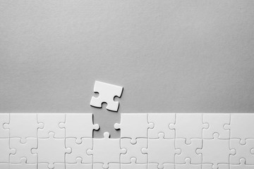 Jigsaw puzzle on light background