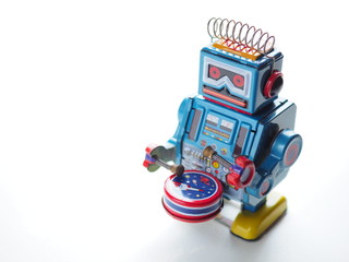 Robot winding Made of zinc sheets printed. It's a toy in the old days. On a white background in the collection and vintage concept.