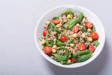 Spinach salad with quinoa , tomatoes and chickpea