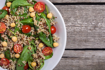 Spinach salad with quinoa , tomatoes and chickpea