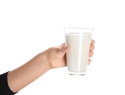 Female Hand Holding Glass Of Tasty Milk On White Background