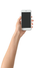 Young woman holding mobile phone on white background
