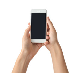 Young woman holding mobile phone on white background