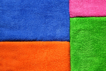 Fototapeta premium Color terry towels as background, closeup