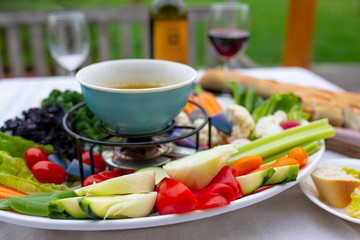 Traditional Italian dish - Bagna cauda. Hot sauce and raw vegetables.

