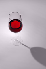 Glass with sweet tasty wine on white background