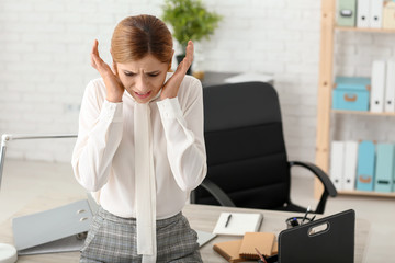 Woman having panic attack at workplace